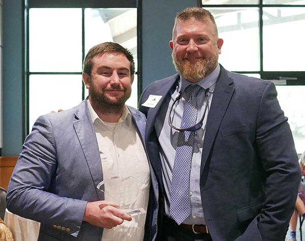 Trey Capps, left, 2010 Scholar, received the 2022 Jake Salley Alumni Service Award. Presentation of the award was made by Ryan Sneed, right, 1995 Scholar and 2019 Jake Salley Award recipient.